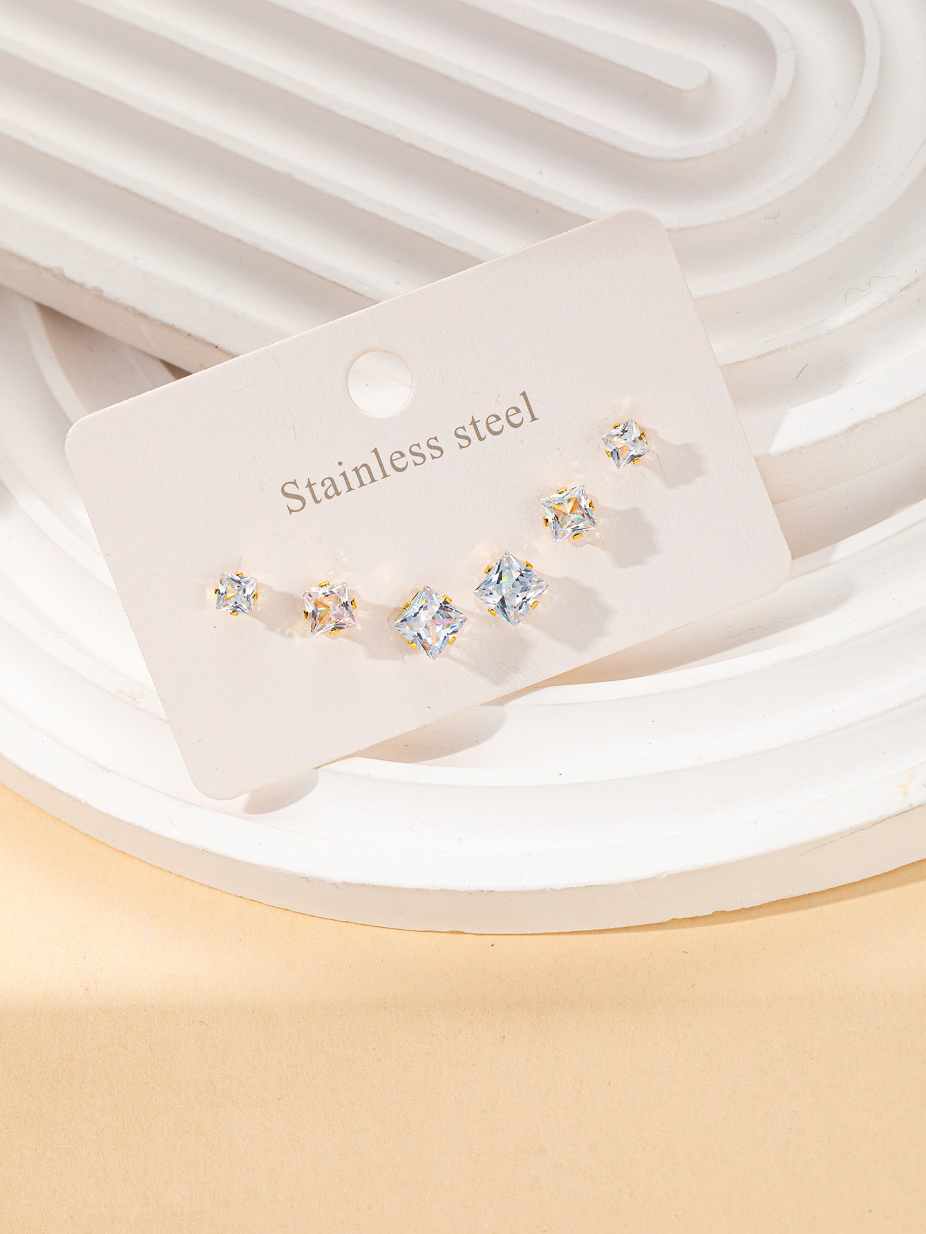 Aretes inox chapado 123